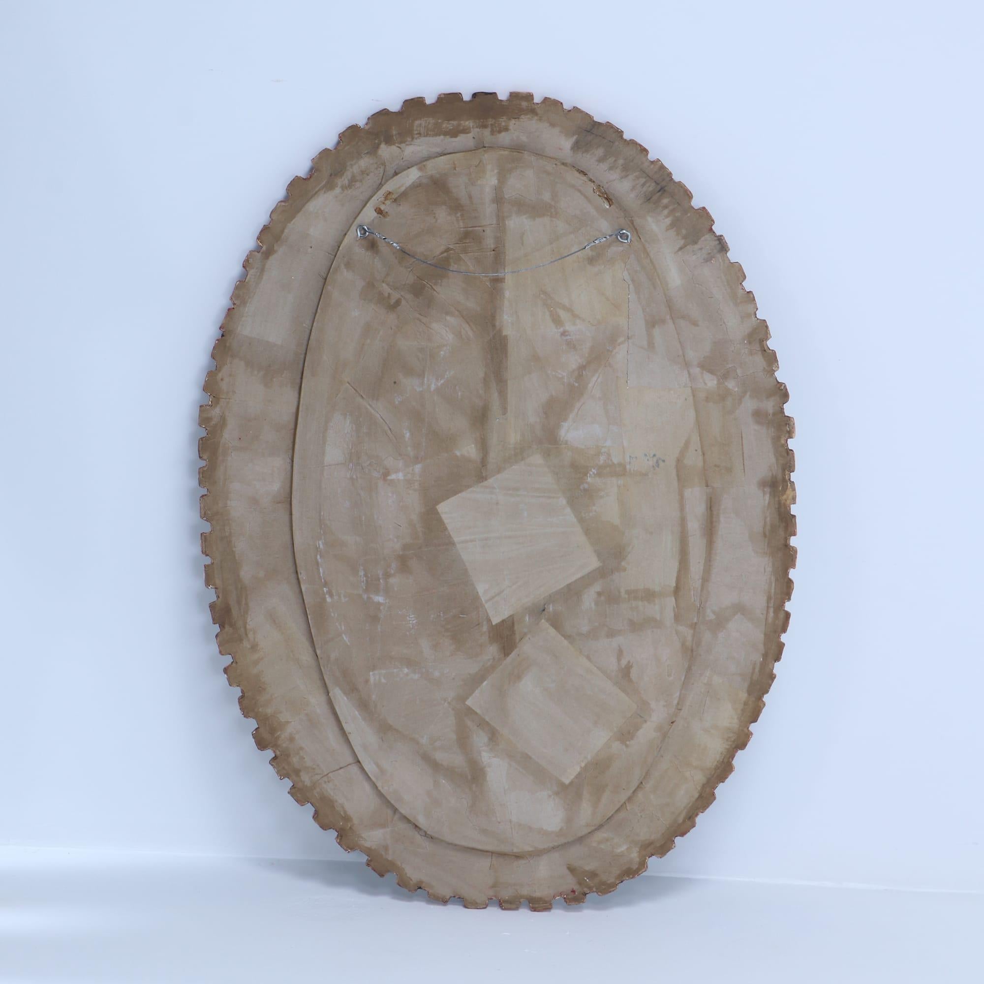 Glass An oval mirror made of gilt resin and blue glass in the manner of Line Vautrin.  For Sale