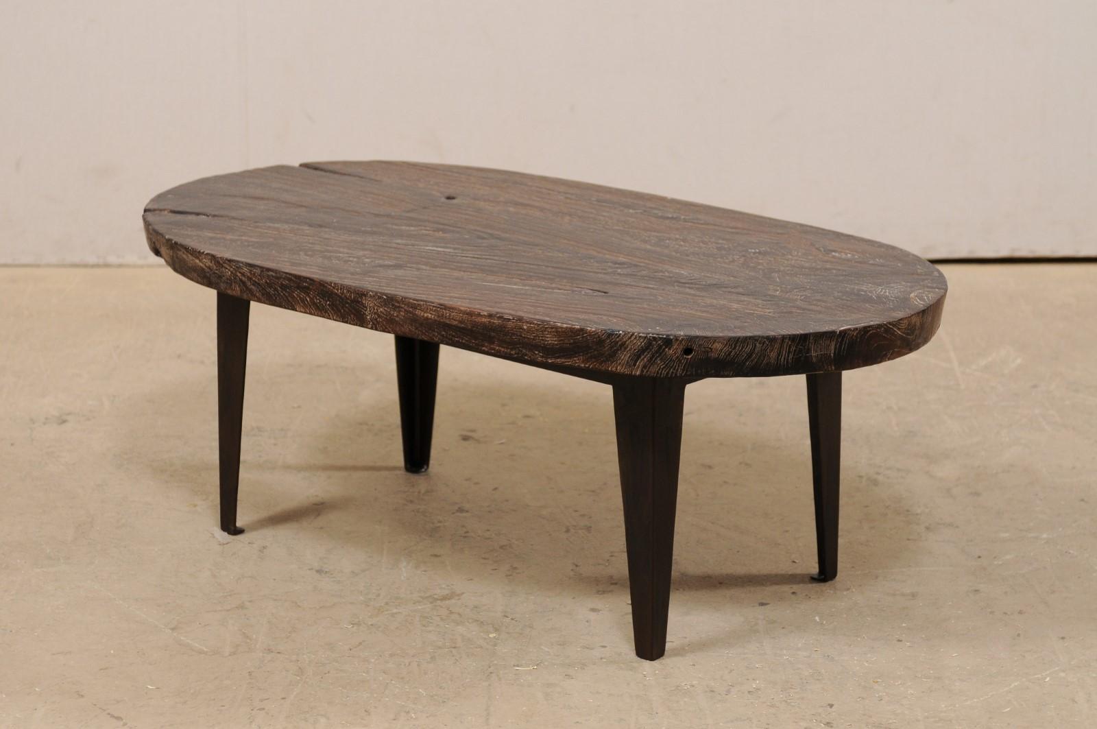 Oval-Shaped Teak Slab Top Coffee Table Raised on Custom Iron Legs For Sale 4