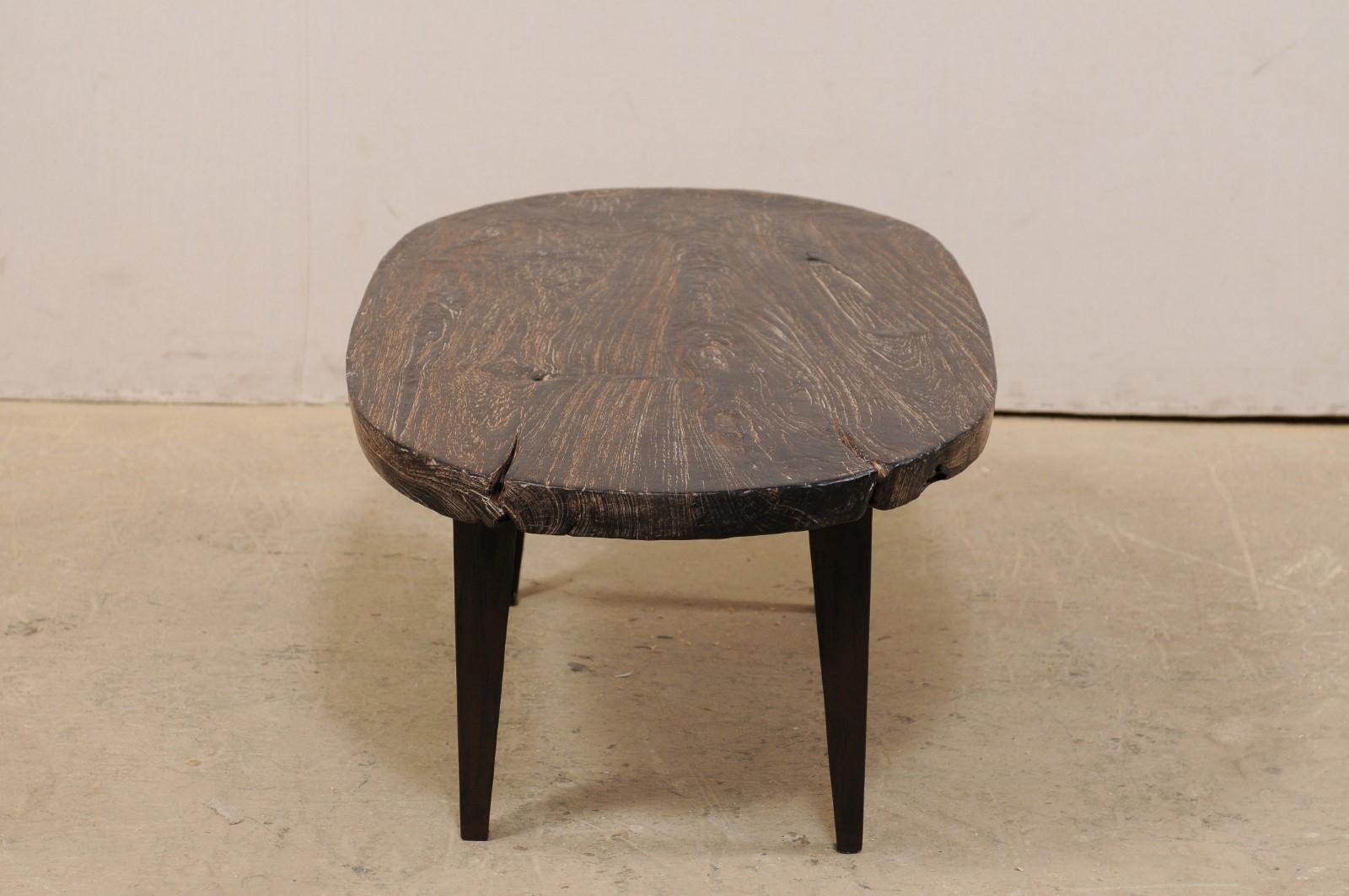 Contemporary Oval-Shaped Teak Slab Top Coffee Table Raised on Custom Iron Legs For Sale