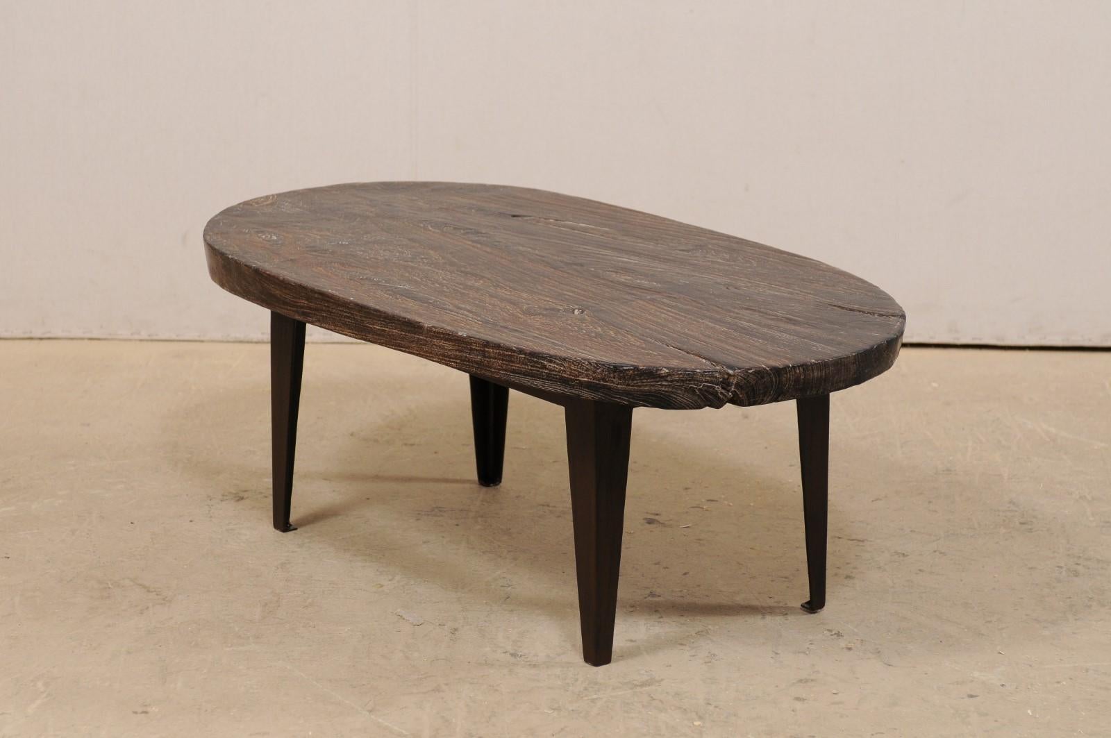 Oval-Shaped Teak Slab Top Coffee Table Raised on Custom Iron Legs For Sale 1