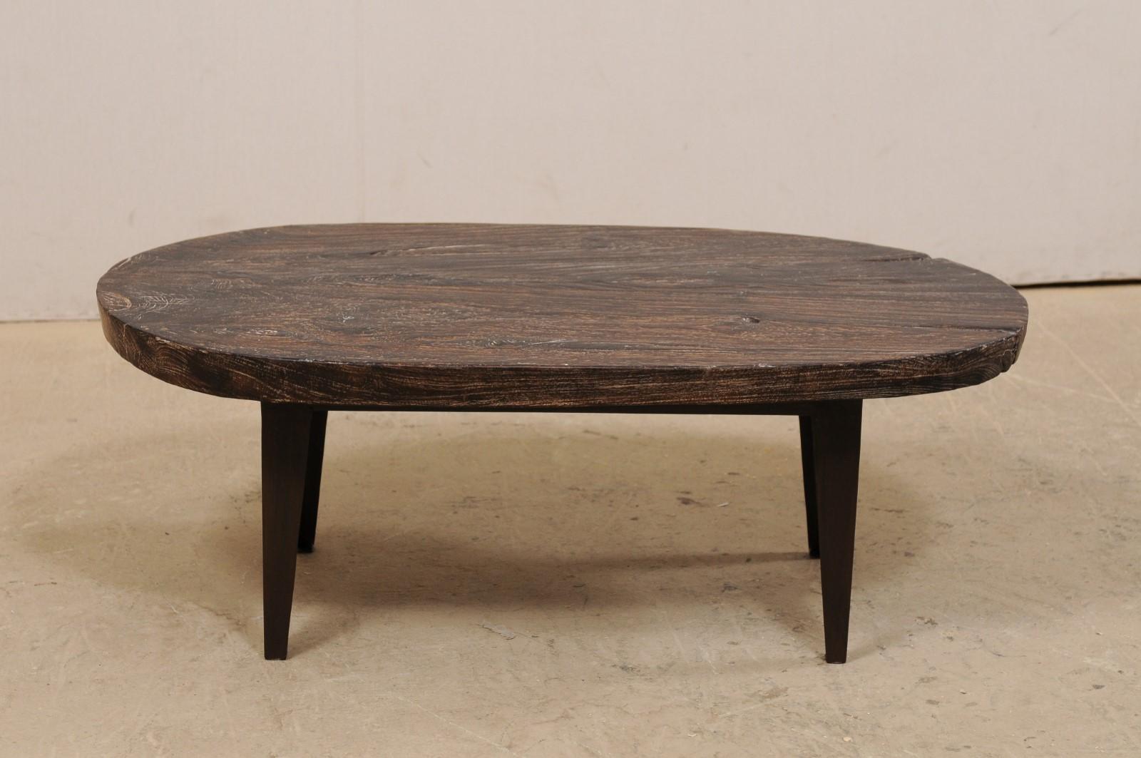 Oval-Shaped Teak Slab Top Coffee Table Raised on Custom Iron Legs For Sale 2