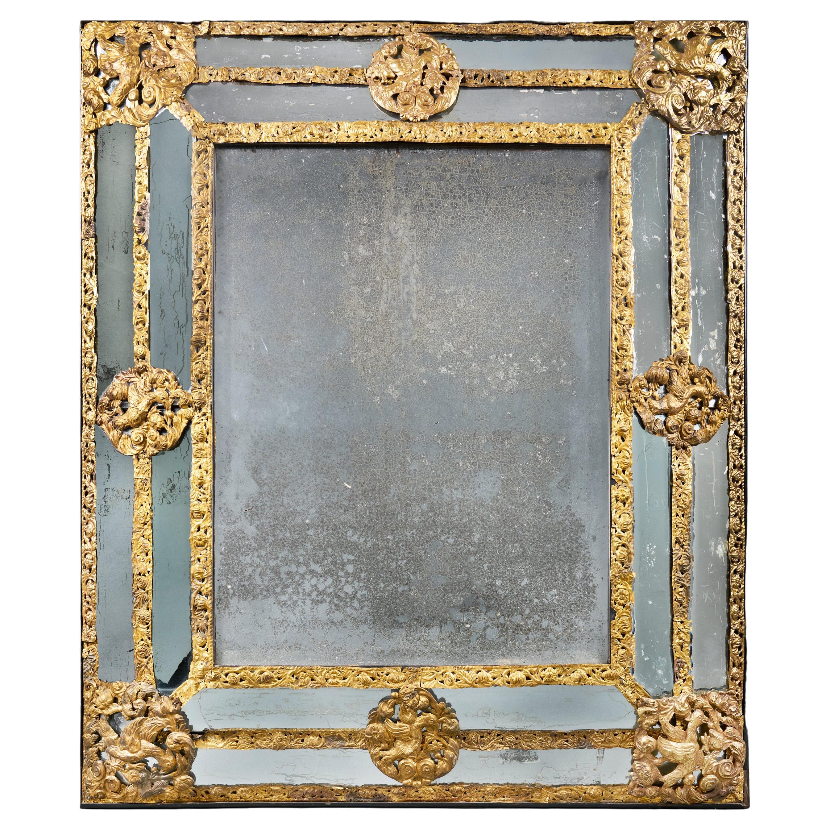 An Overscale Mid-19th Century Brass Repousse Mirror For Sale