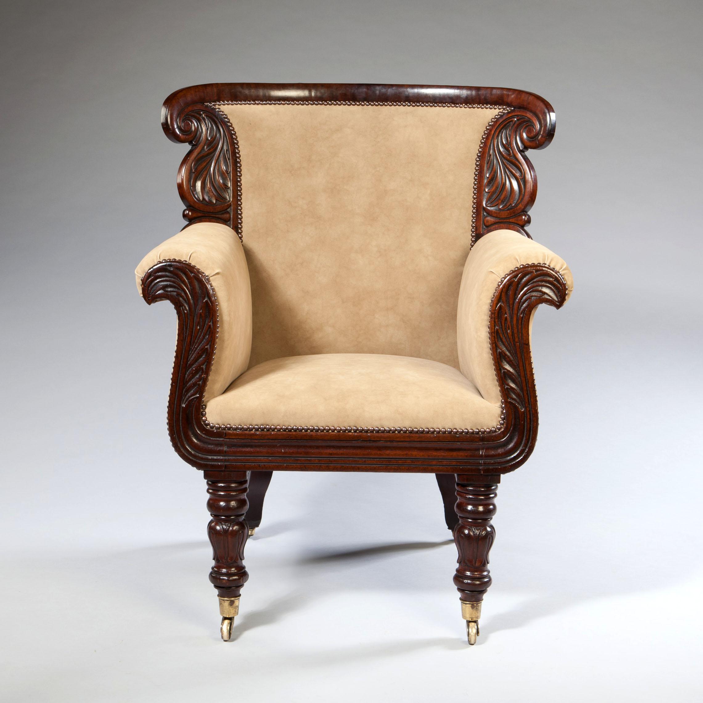 A fine mid 19th century mahogany armchair of generous scale with boldly carved frame of acanthus levels supported on tapering legs terminating in brass castors. Upholstered in beige suede. 

Height     103.00cm
Width      85.00cm
Depth      71.00cm