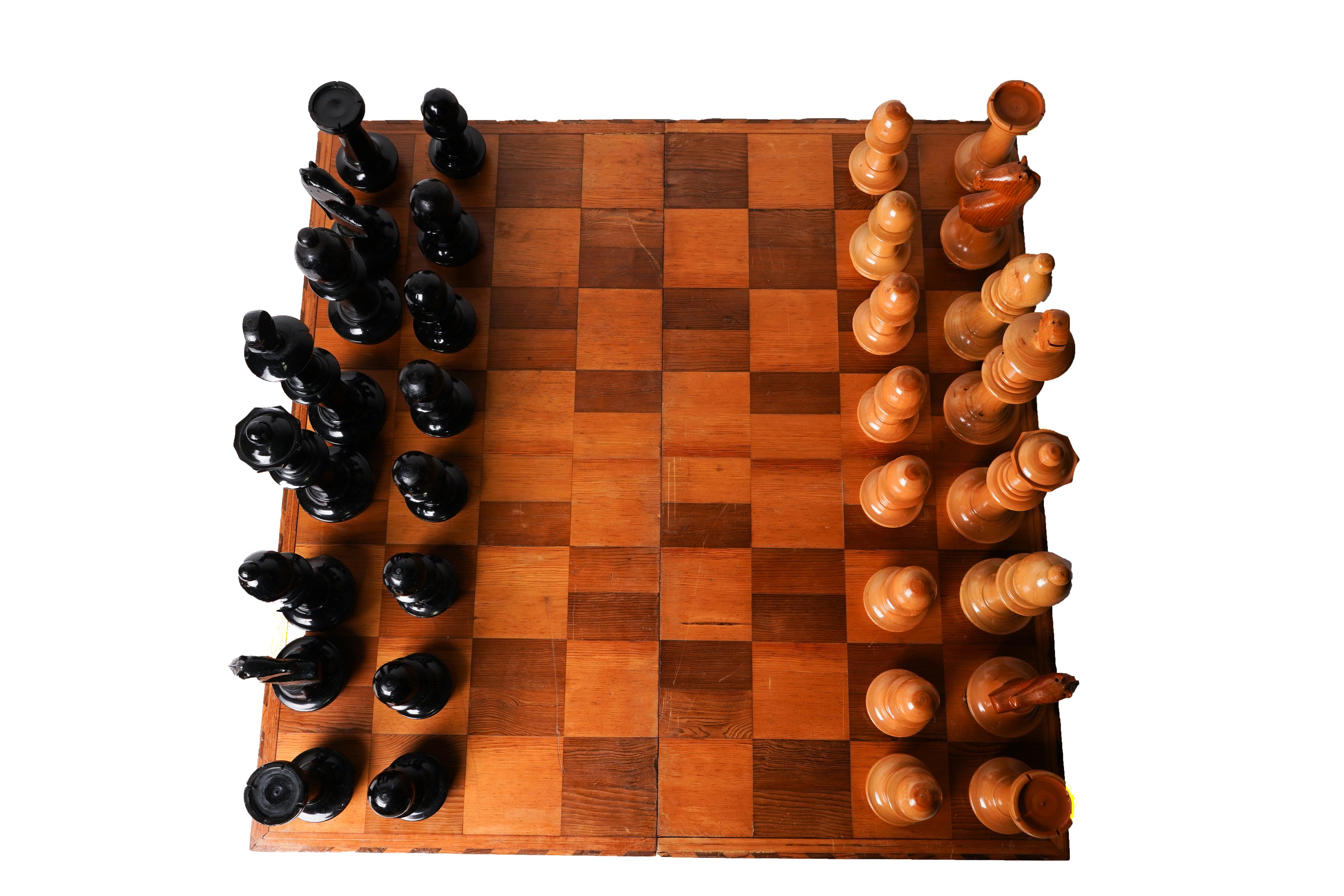 This dramatically over-scaled chess set is made from poplar wood, covered in natural lacquer. The sturdy box provides storage for the pieces as well as a gameboard.