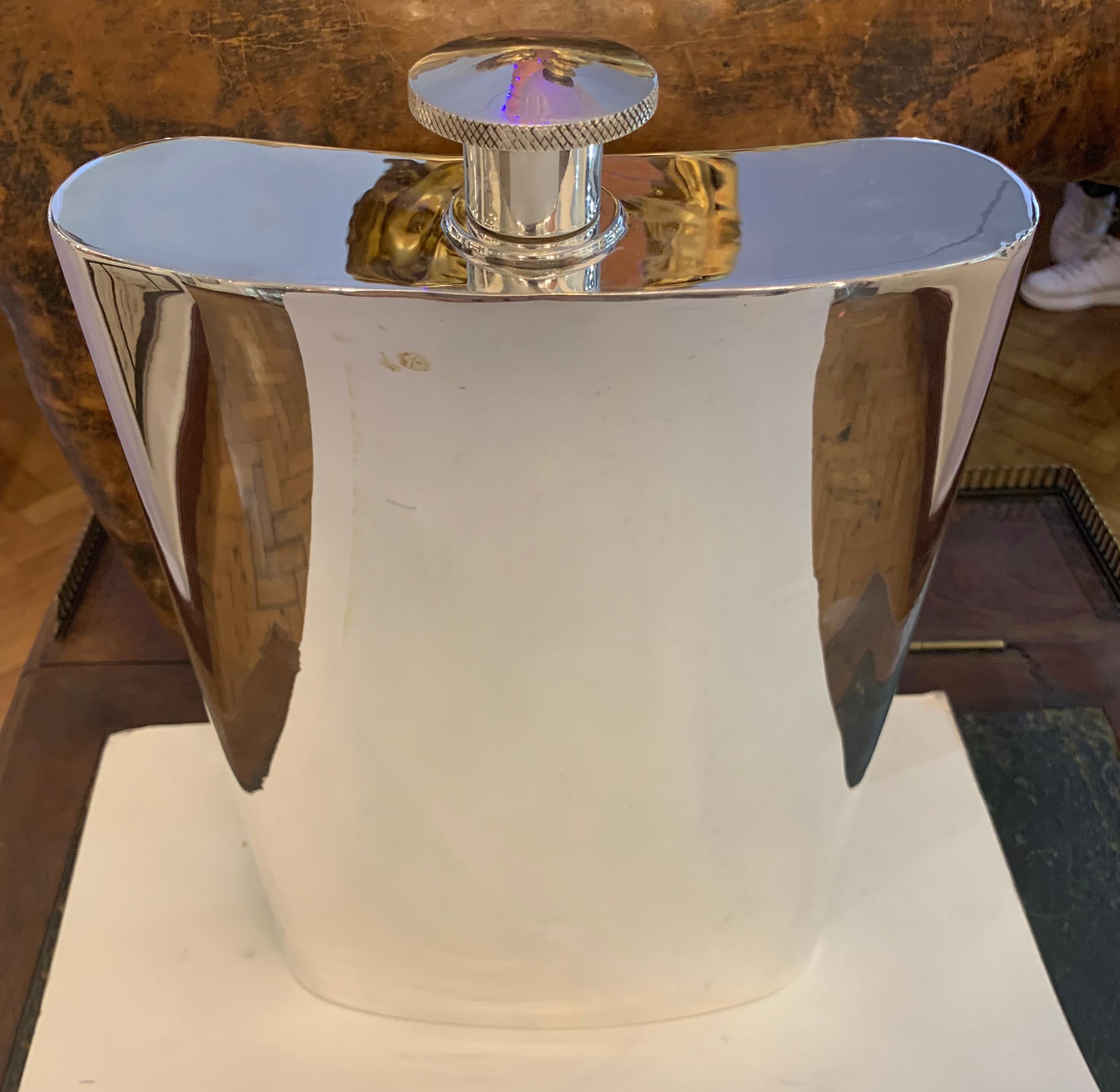 A very unusual and very large, 1 gallon silver plated hip flask. English, circa 1950.

The over sized flask having a removable screw cap and in perfect usable condition.

Stamped to the lower reverse: 