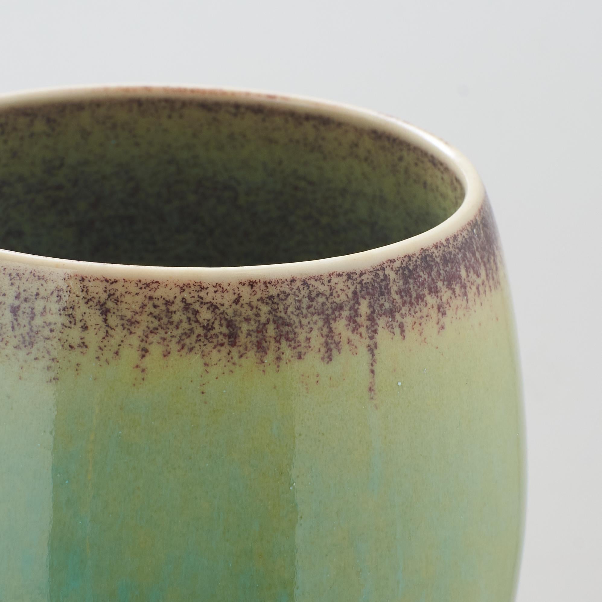 An ovoid vase with green glaze on tall stone base by Stig Lindberg In Good Condition In San Francisco, CA