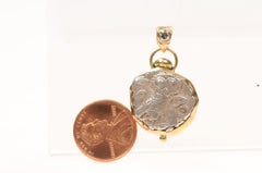 An Owl [coin] Pendant with Round Diamond in 18 karat gold