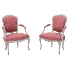 Antique An pair of painted and carved  French Louis XV style open arm chairs circa 1900.