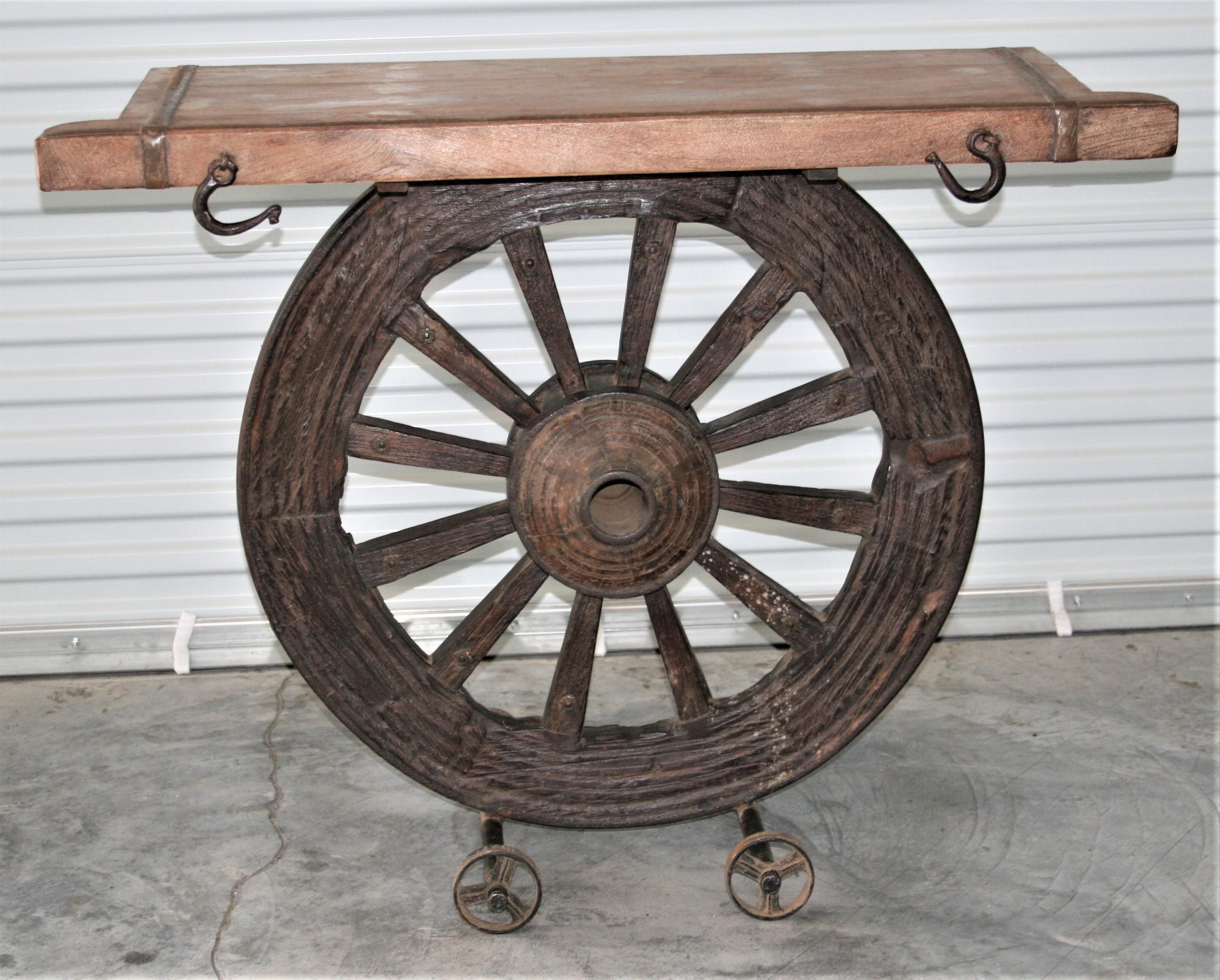 In late 19th century Calcutta was a busy port and was used by the British East India Company for handling their imports and exports. Heavily fortified carts drawn by stock bulls were used for hauling the goods in and out of ports. This console table