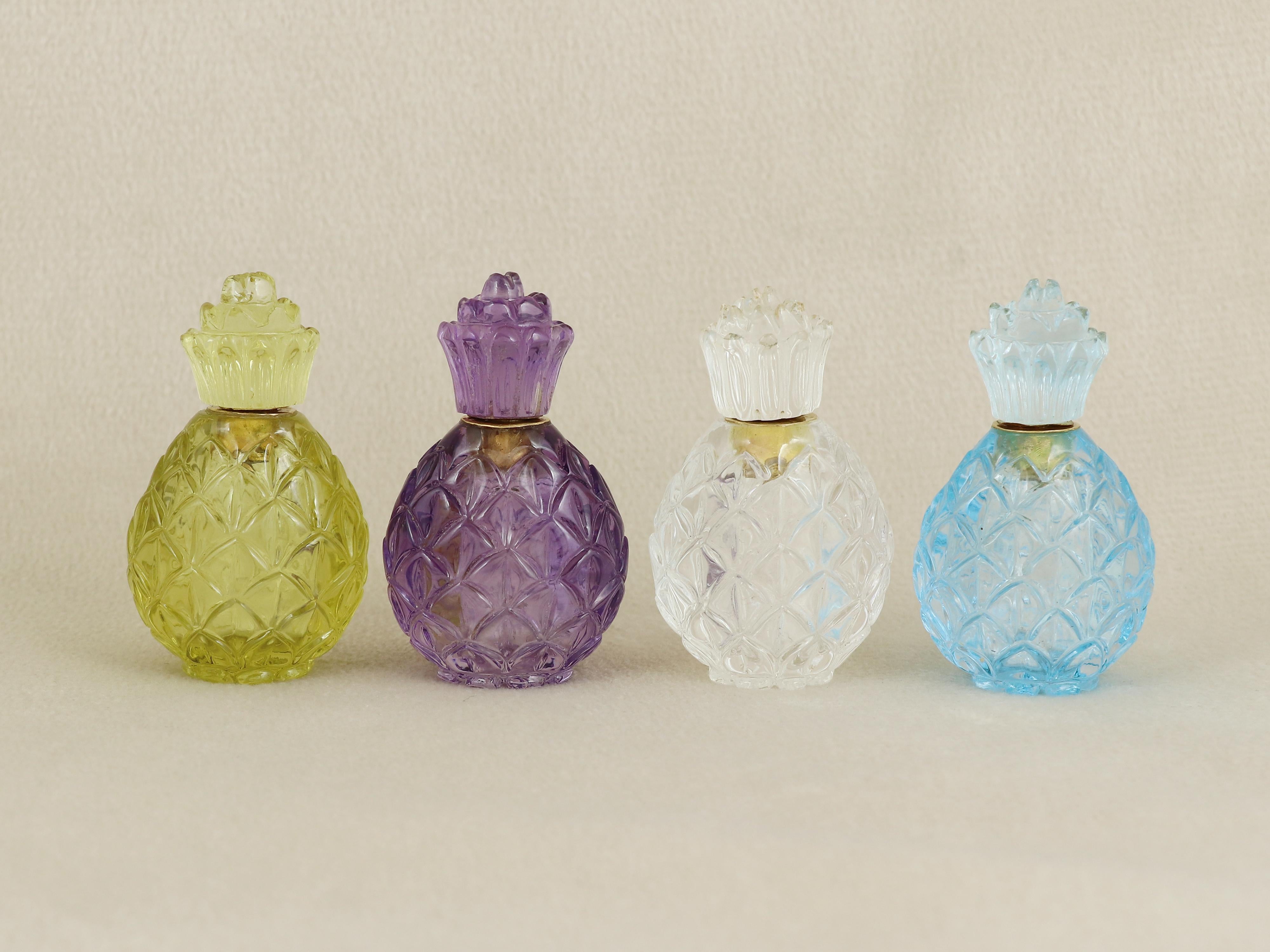 A rare and captivating collection of eight hand-carved gemstone perfume bottles, each sculpted in the form of a stylized pineapple—a timeless symbol of welcome, abundance, and luxury. Crafted in Jaipur, India’s renowned hub of gem artistry, these