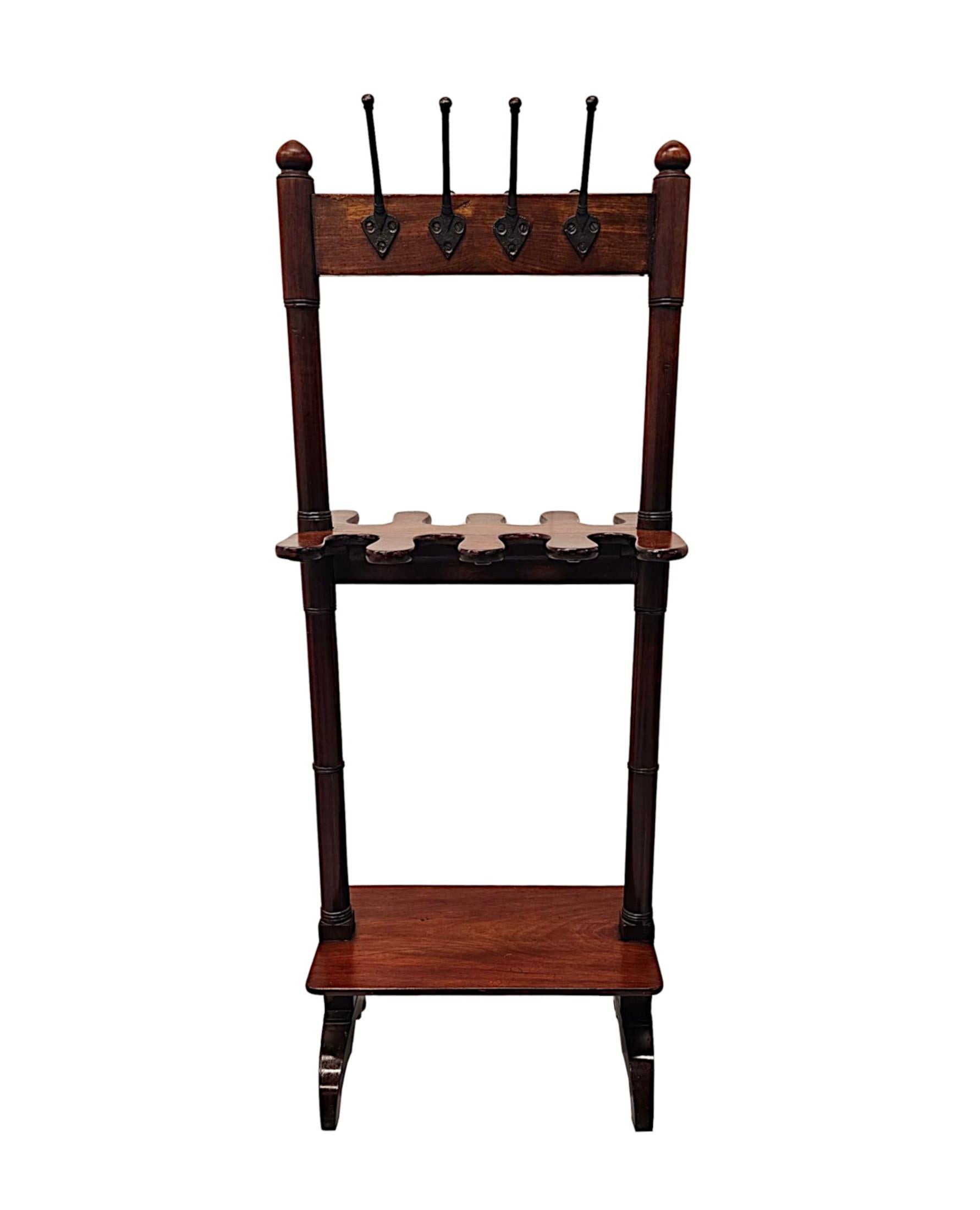 A very fine and unusual 19th Century Country House mahogany double sided boot and Coat rack.  This very fine piece is beautifully hand carved, of exceptional quality and with rich patination and grain.  This well figured, moulded three tier boot and
