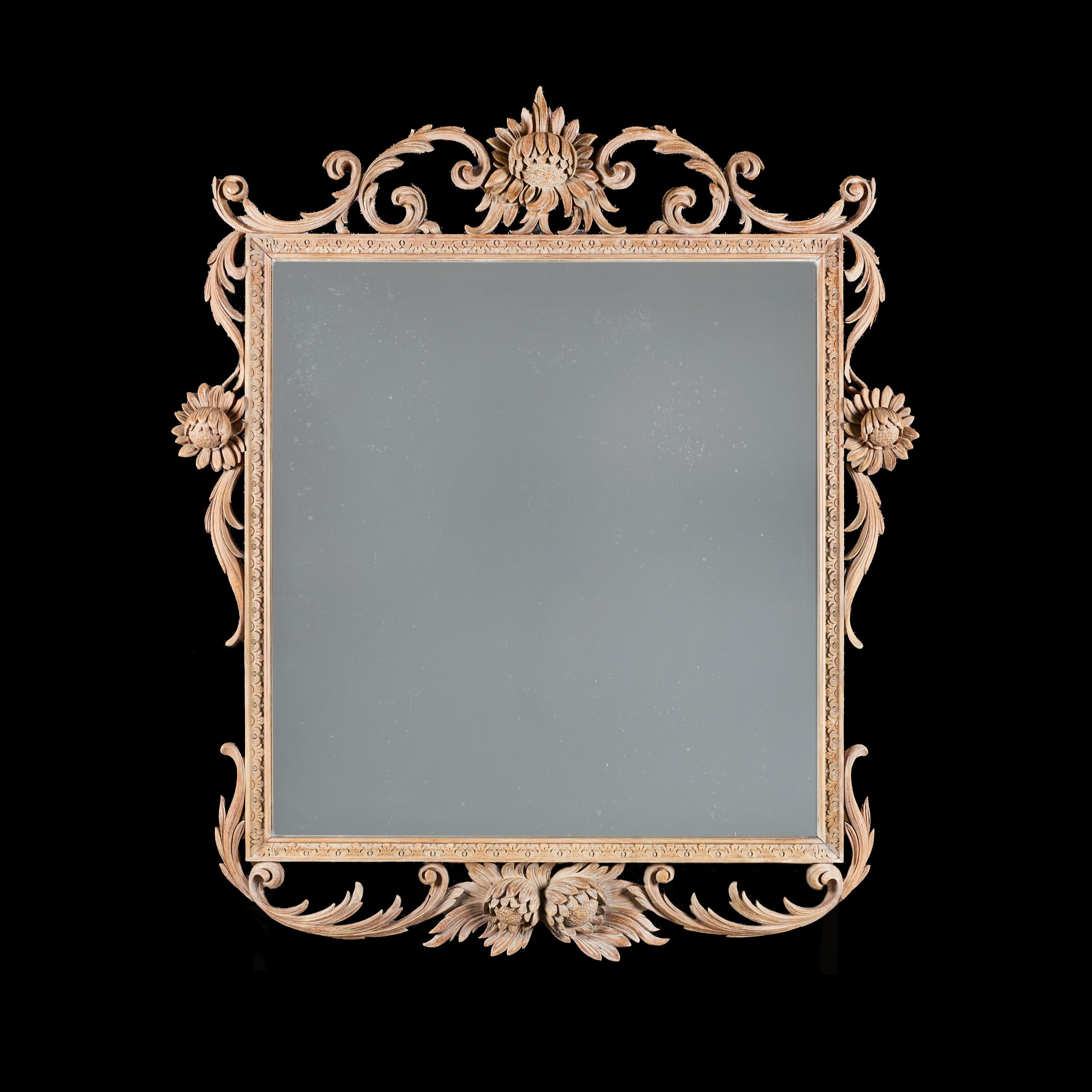 Angleterre, vers 1900.

Miroir de cheminée édouardien en pin sculpté, décoré de motifs de tournesols et de rinceaux de feuillage imbriqués, le cadre intérieur étant sculpté de moulures dentaires.

Hauteur 147.00 centimètres.
Largeur 126.00