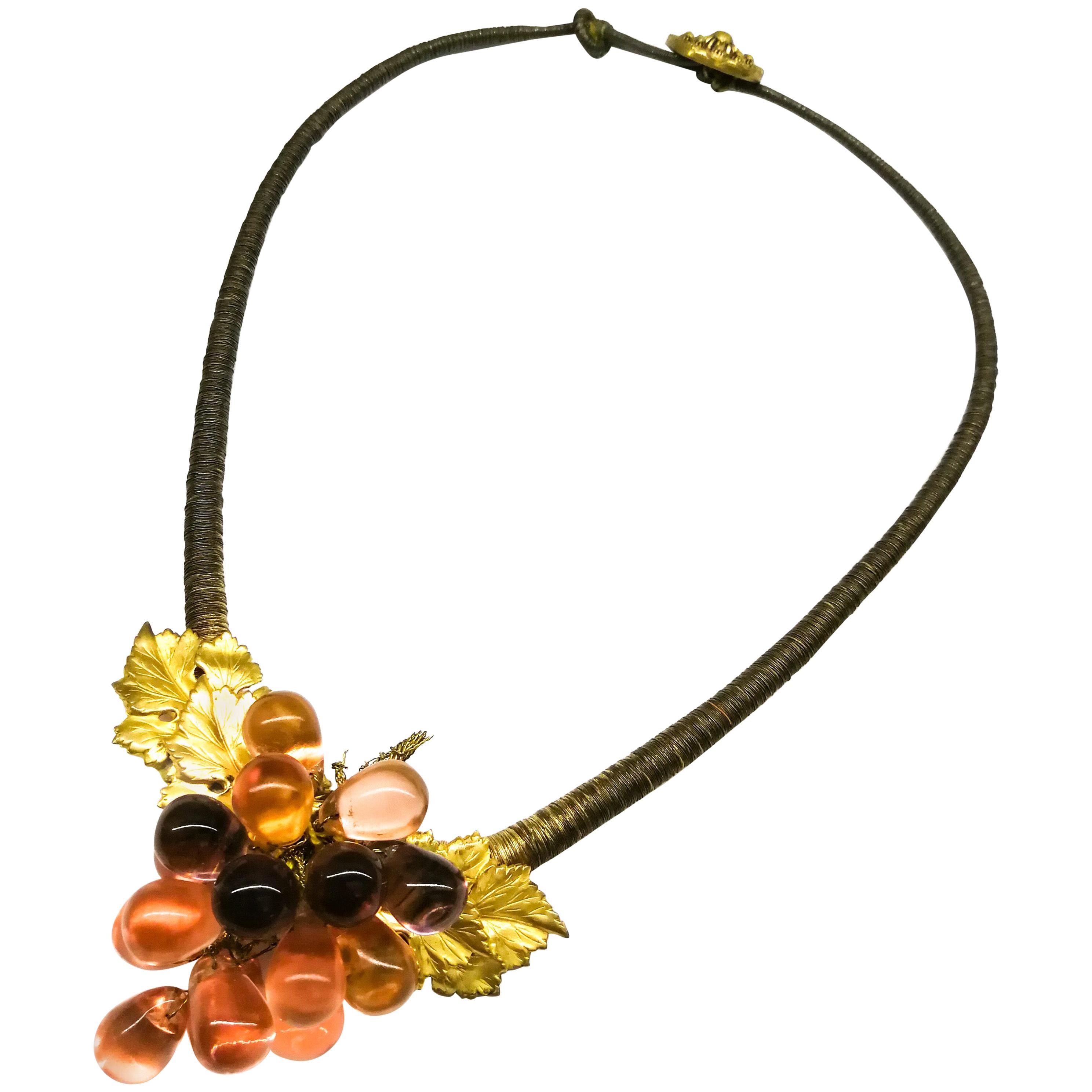 An unusual coloured glass and gilt metal 'grape' necklace, France, 1920s.