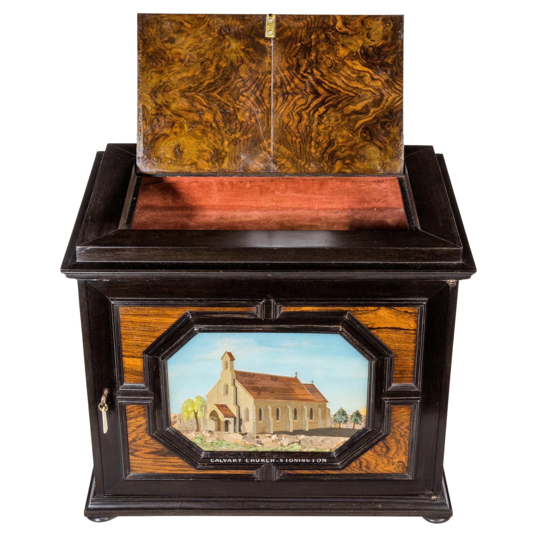 An unusual ebony bijouterie table cabinet showing Calvary Church, Stonington, Lo For Sale