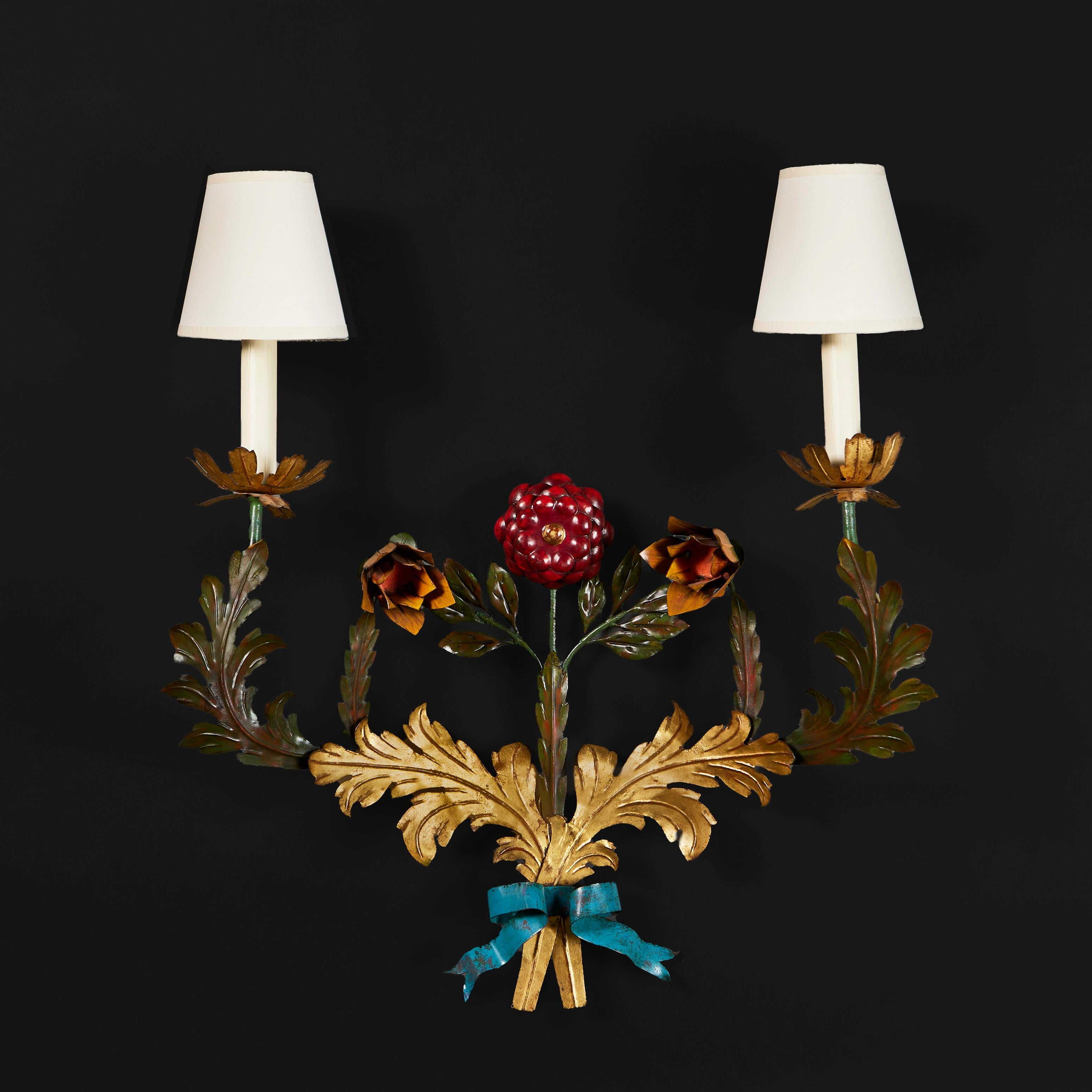 France, circa 1900

A French painted tole wall light, the metal cut and embossed to depict a flower bouquet with central red rose, tulips and gilded leaves all tied with a blue ribbon.

Height 60.00cm

Width 59.00cm

Depth 20.00cm