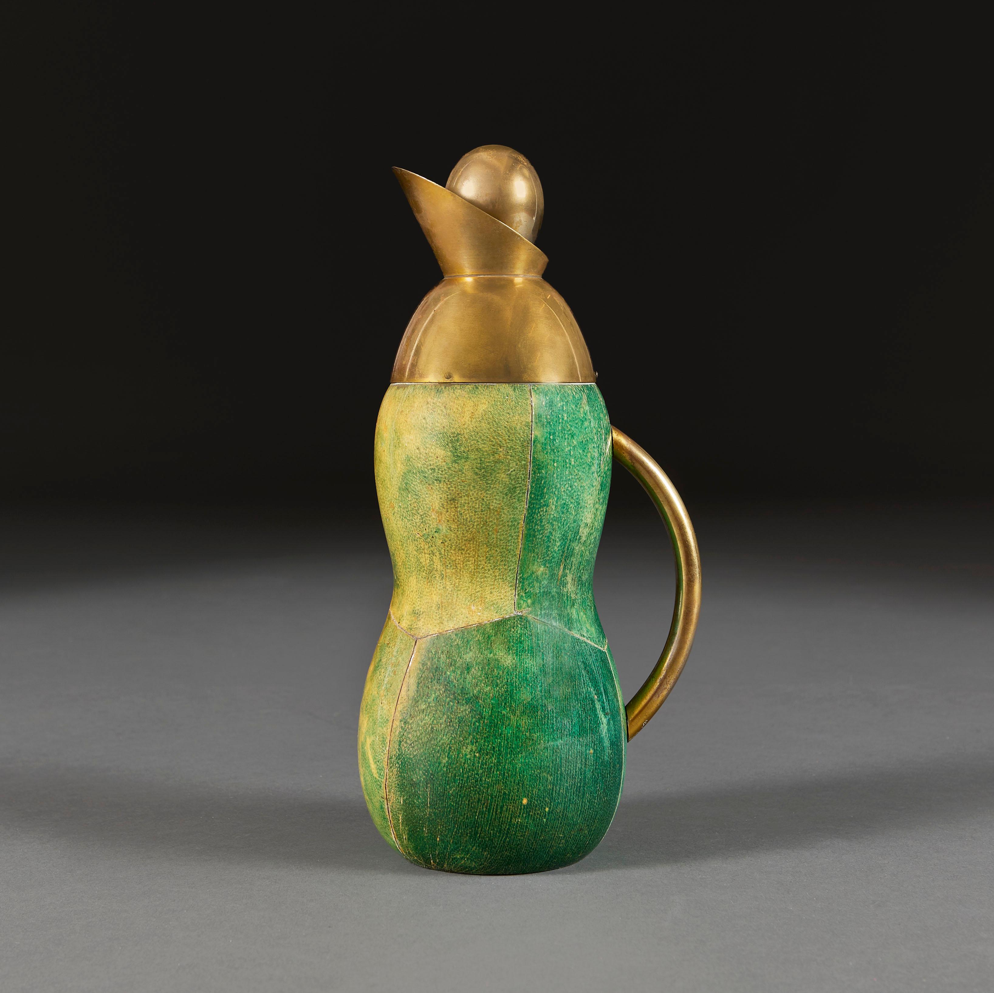 Italy, circa 1970

An unusual mid century Italian thermos flask with a wooden segmented body finished in lacquered vellum that is dyed green to simulate shagreen, with brass handle and spout.

Height 31.00cm
Width 14.00cm
Depth 11.00cm