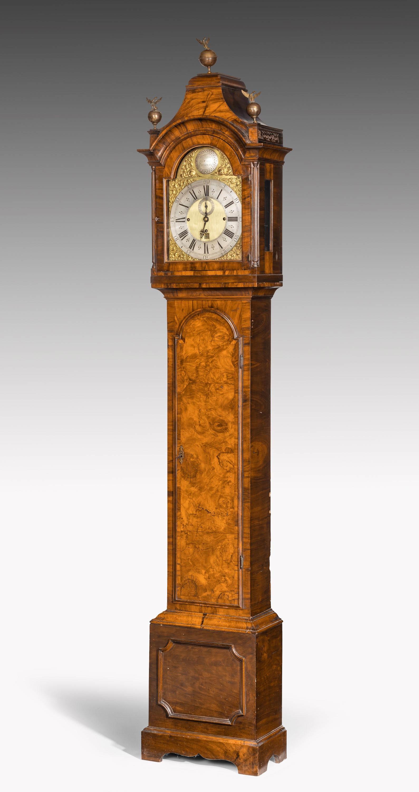 An unusual longcase clock in a fine but very retrained walnut frame and a hooded top. The name William Harris engraved on the plate. Harris was active in the second and third quarters of the 18th century in London.  The whole of the mechanism has