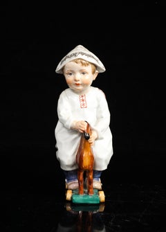 An Unusual Meissen Porcelain Figure of a Boy on a Pull Toy, by Konrad Hentschel