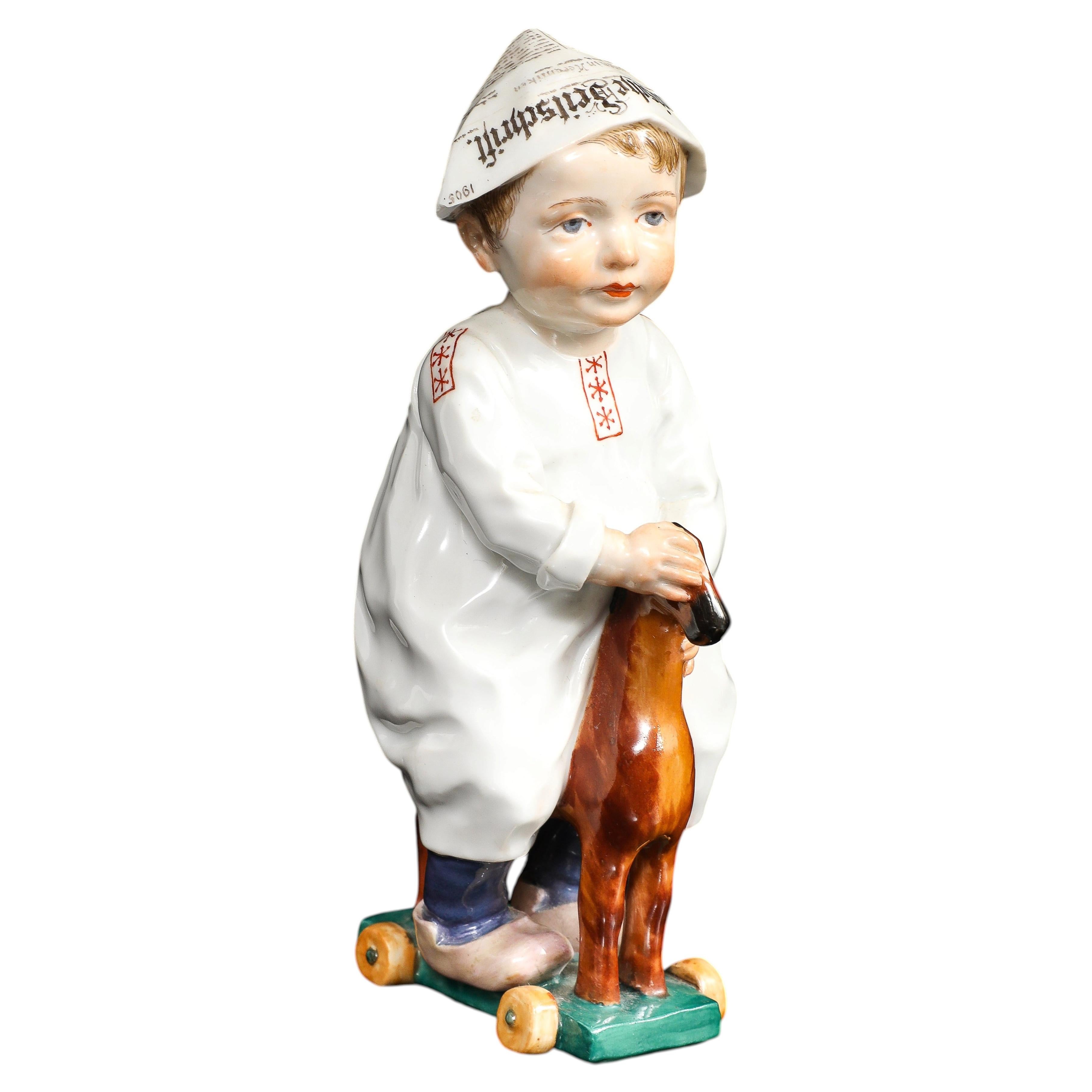 An Unusual Meissen Porcelain Figure of a Boy on a Pull Toy, by Konrad Hentschel
