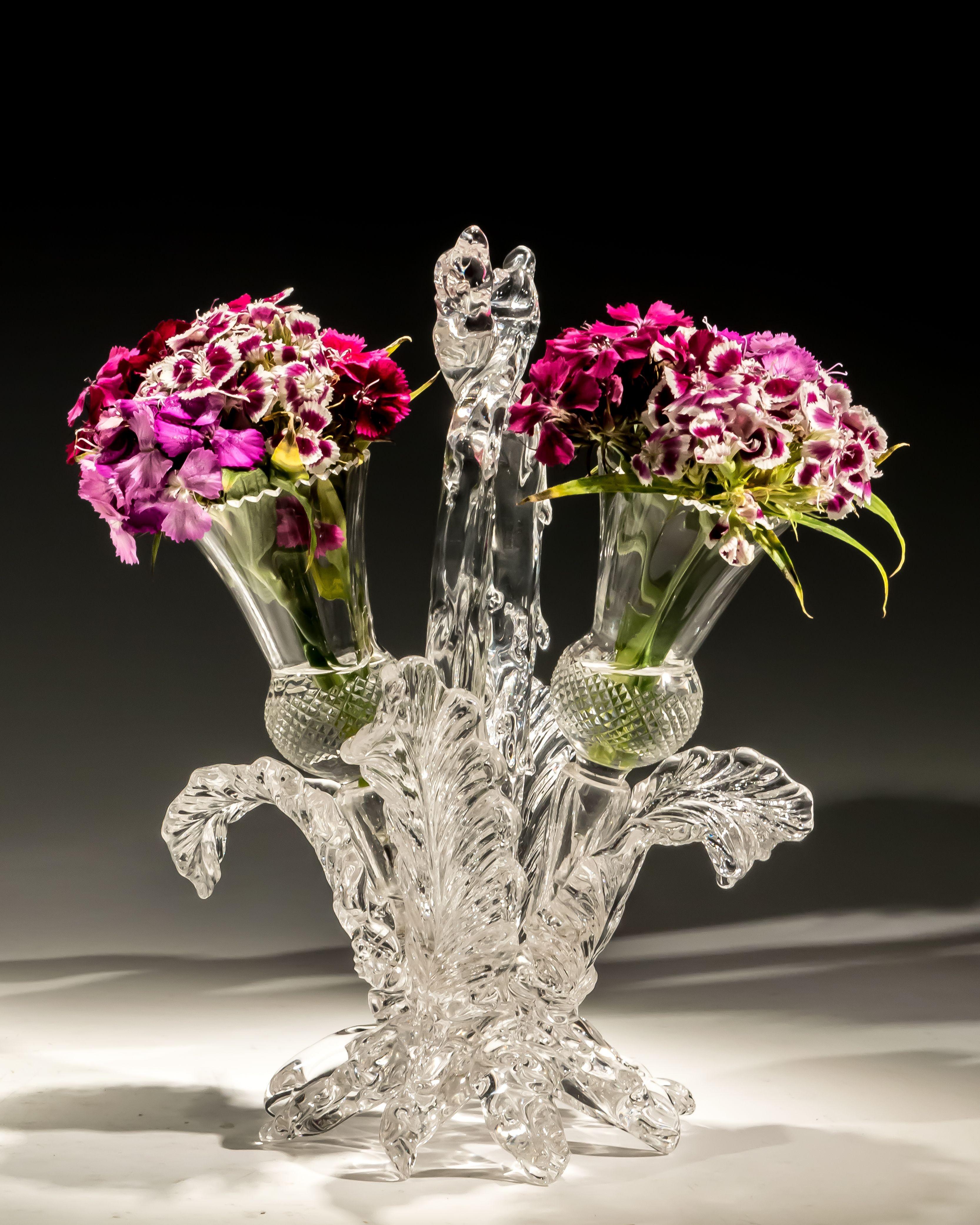 An unusual pair of moulded and cut glass flower epergnes.

England, circa 1910.

Dimensions:

Height: 23.5 cm (9 1/4