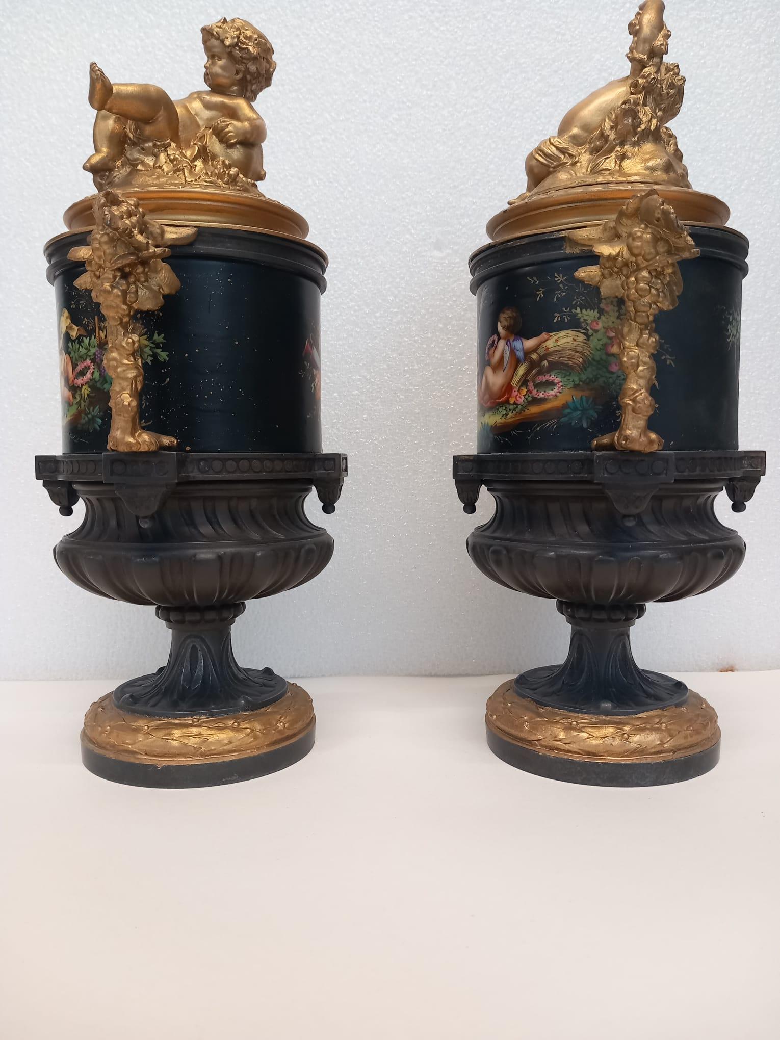 19th Century An unusual pair of  French vases hand painted in bright enamel colours For Sale