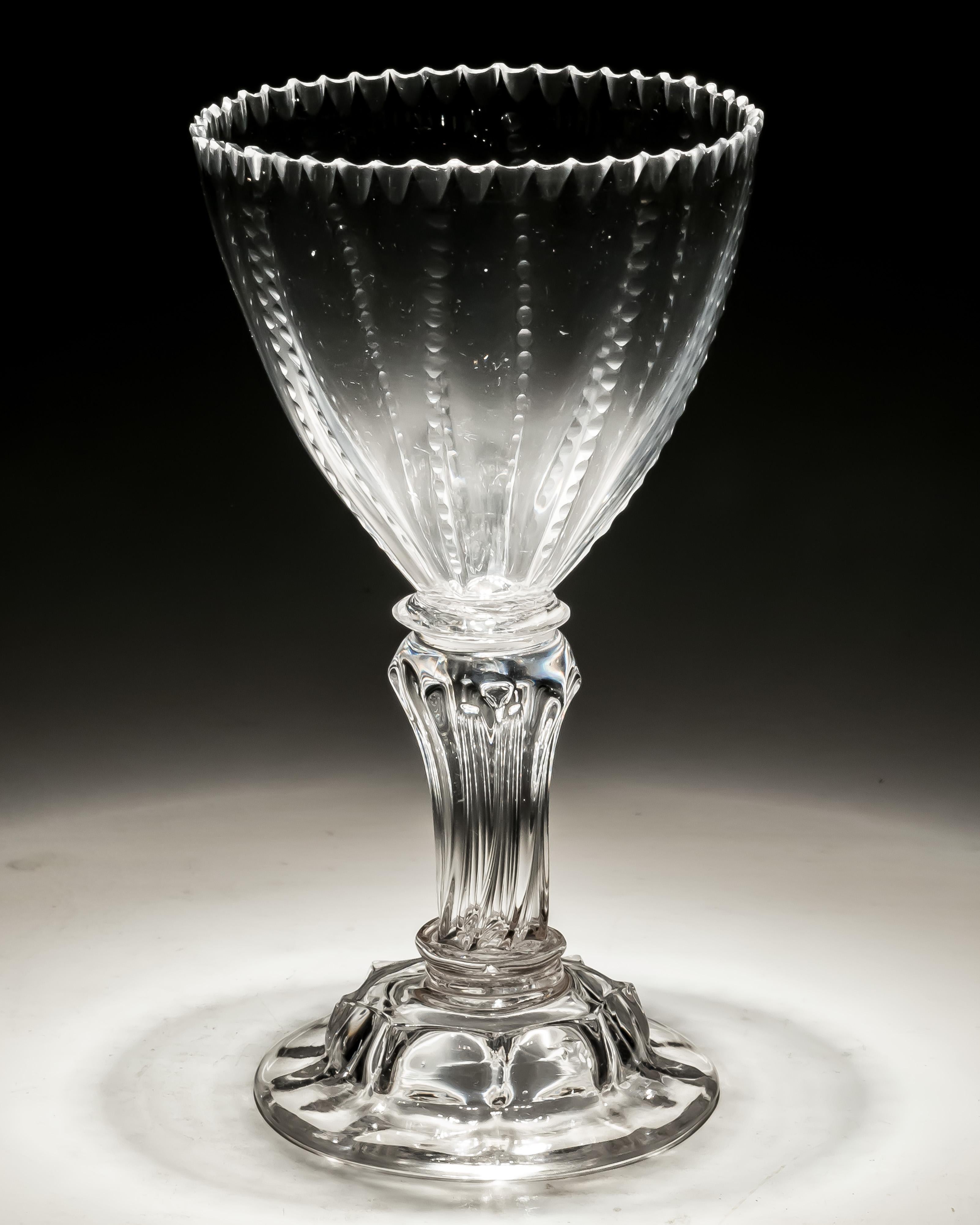 An unusual pedestal stem sweetmeat with ribbed and notched bowl.

England, circa 1750.
Measures: Height: 17.5 cm (7