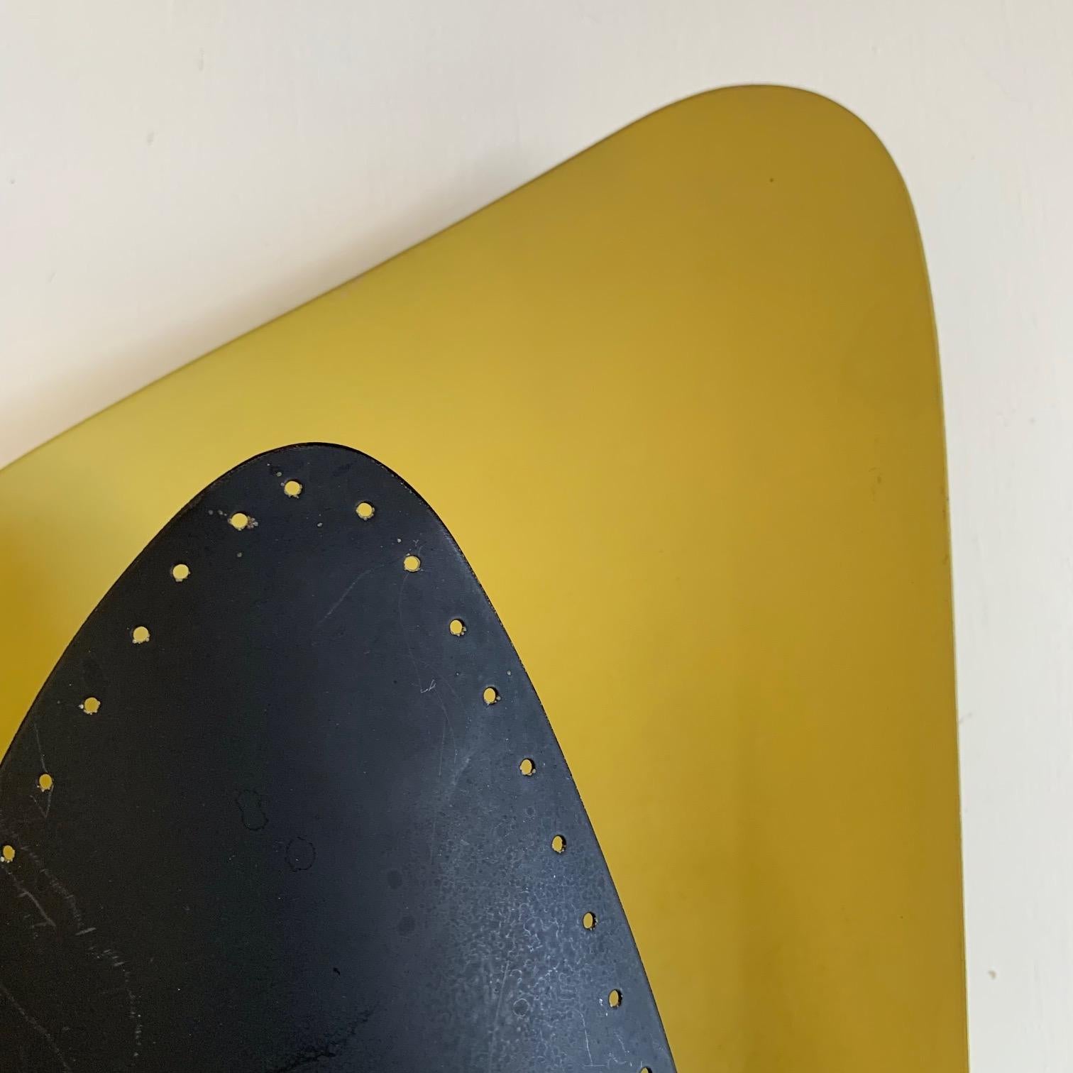 An interesting sconce from Germany, circa 1950s. Original yellow/black paint. Very sculptural, midcentury look.