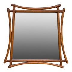 An unusual shaped 1970s wood and leather mirror in the style of Vivai Del Sud