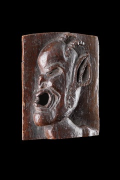 An Unusual Small Carved Plaque of a Horned Devil or ‘Demon’