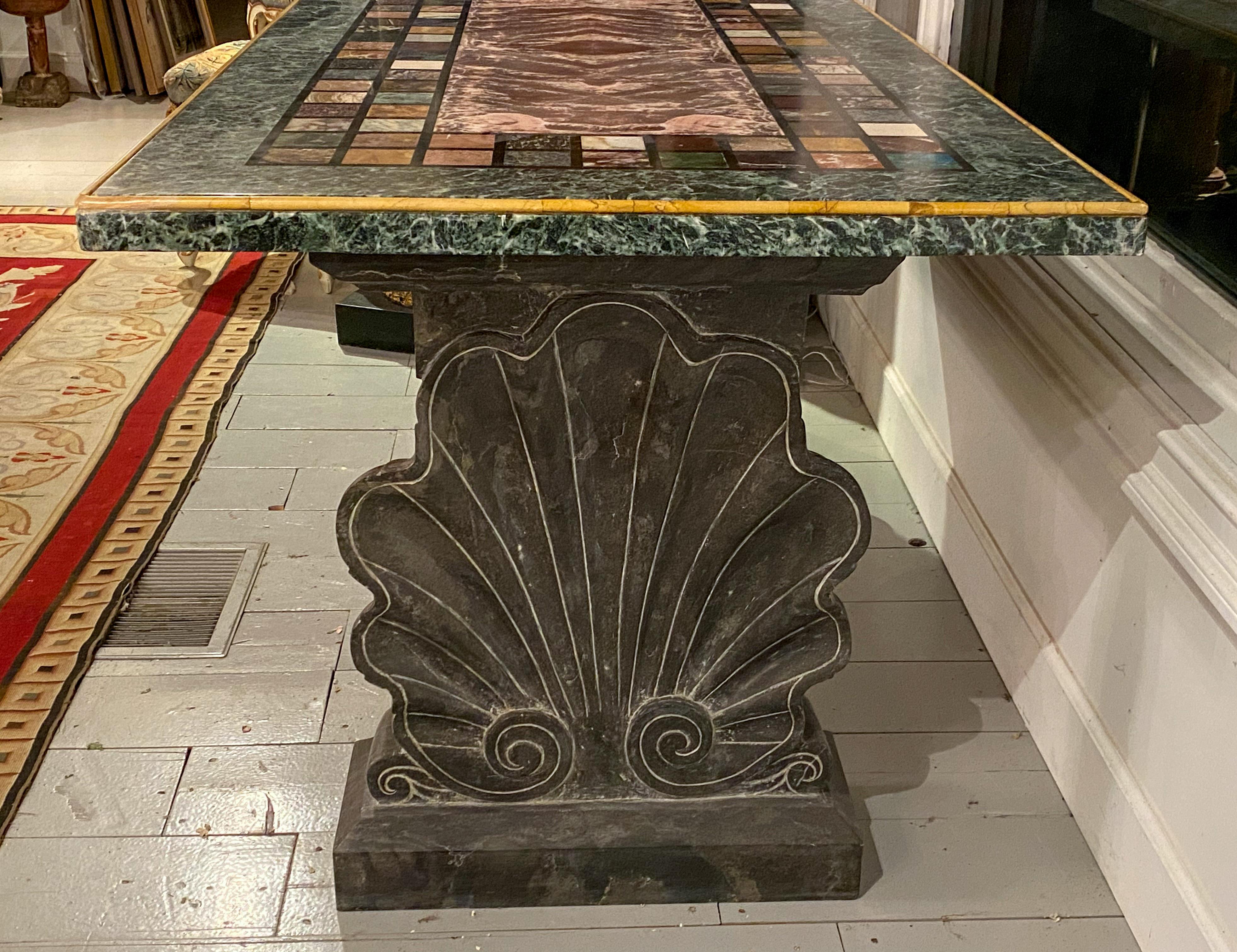 An unusual “Specimen Petra Dura” marble top table
Resting on very rare shell form support bases
Possibly Florence, Italy
19th century

Measures: Height 31 in, width 61 in, depth 33 ½ in.

Provenance:
Private Collection Palm Beach, FL.
   
