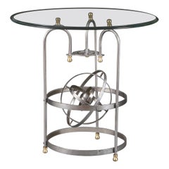 An unusual steel brass astronomical table with glass top