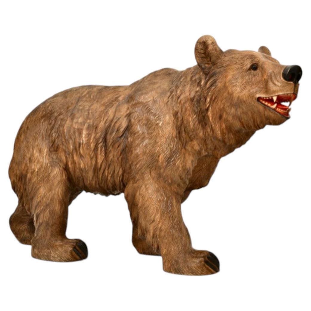 An Unusual Swiss Carved Black Forest Near Life-Size Figure of a Strolling Bear