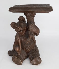 An Unusual Swiss Carved Black Forest Smoking Table, Circa 1900