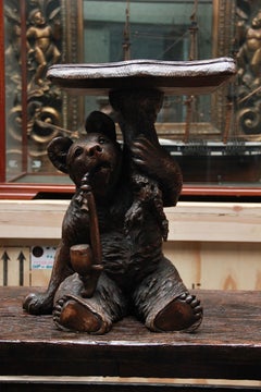 An Unusual Swiss Carved Black Forest Smoking Table, Circa 1900