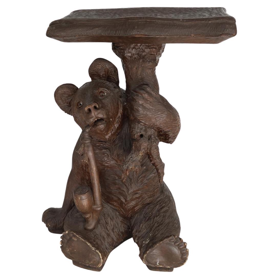 An Unusual Swiss Carved Black Forest Smoking Table, Circa 1900