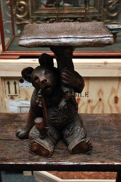 An Unusual Swiss Carved Black Forest Smoking Table