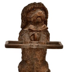 An Unusual Swiss Carved Black Forest tobacco jar and pipe holder