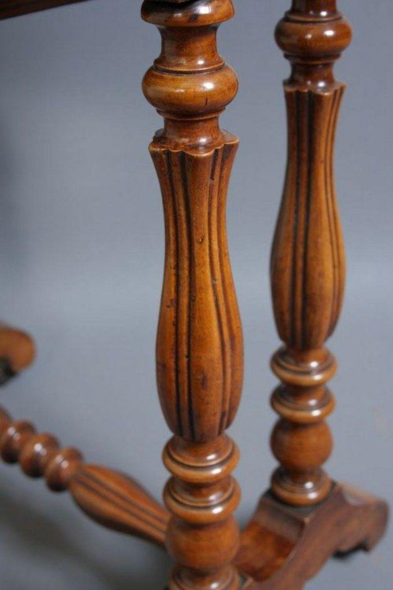Sn138 Very unusual Victorian, walnut work table with shaped lift up lid, fitted interior with carved frieze below and slide out section under frieze, all standing on 4 carved legs with turned stretcher base. All in fantastic condition throughout,