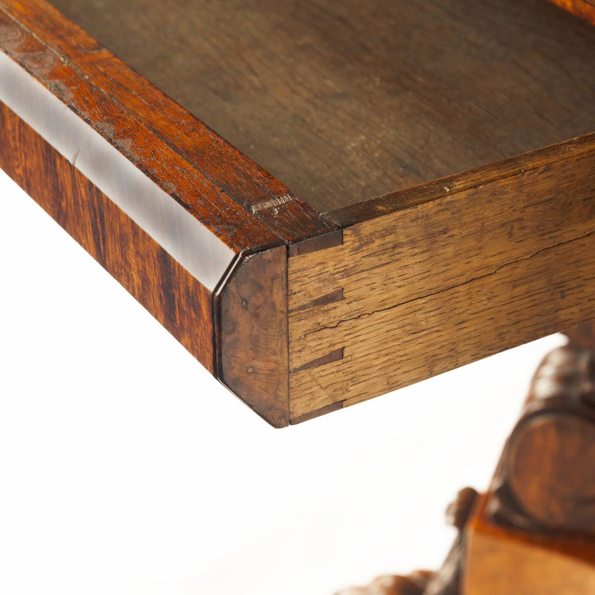 An unusual William IV amboyna and oak four drawer library table by Simpson For Sale 6