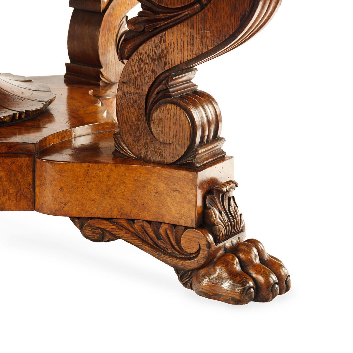 An unusual William IV amboyna and oak four drawer library table by Simpson For Sale 7