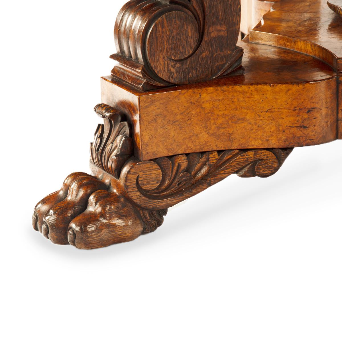 An unusual William IV amboyna and oak four drawer library table by Simpson For Sale 8