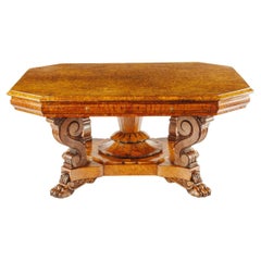 An unusual William IV amboyna and oak four drawer library table by Simpson