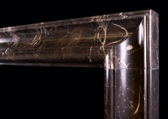 Unusually Shaped English Bolection Moulded Fireplace in Dark Emperador Marble