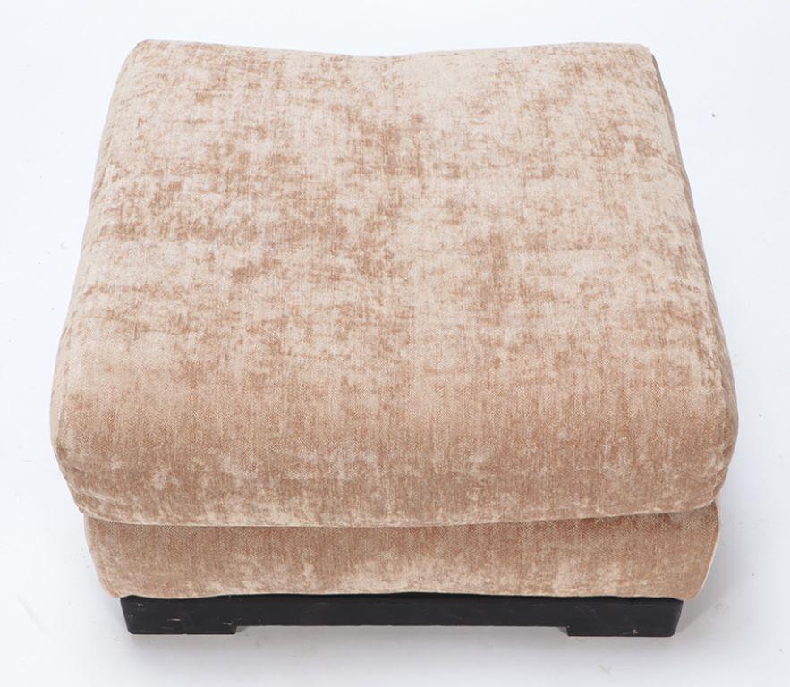 French An upholstered ottoman on ebonized base by Jacques Charpentier circa 1970. For Sale