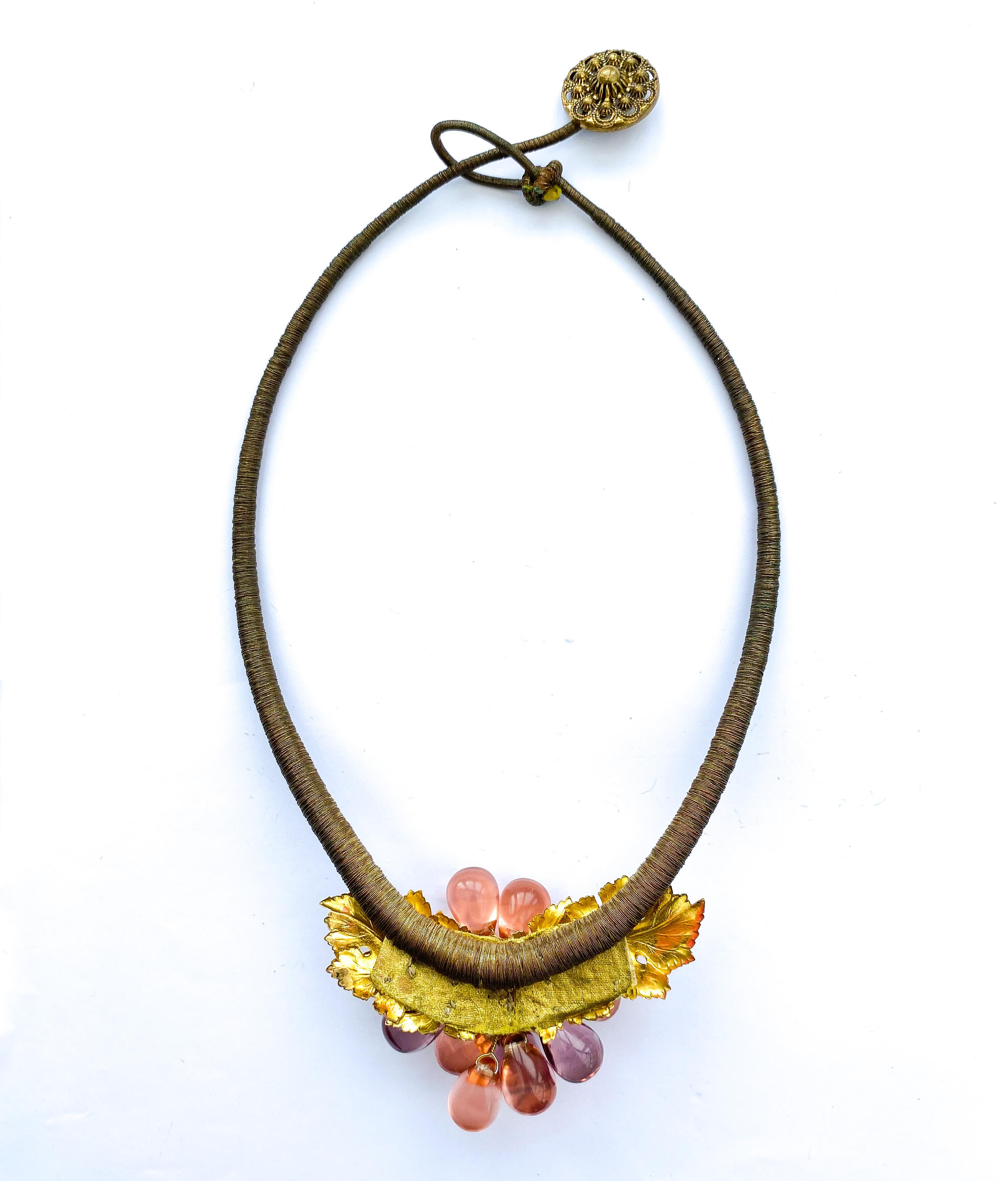 An very unusual coloured glass and gilt metal 'grape' necklace, France, 1920s. 8