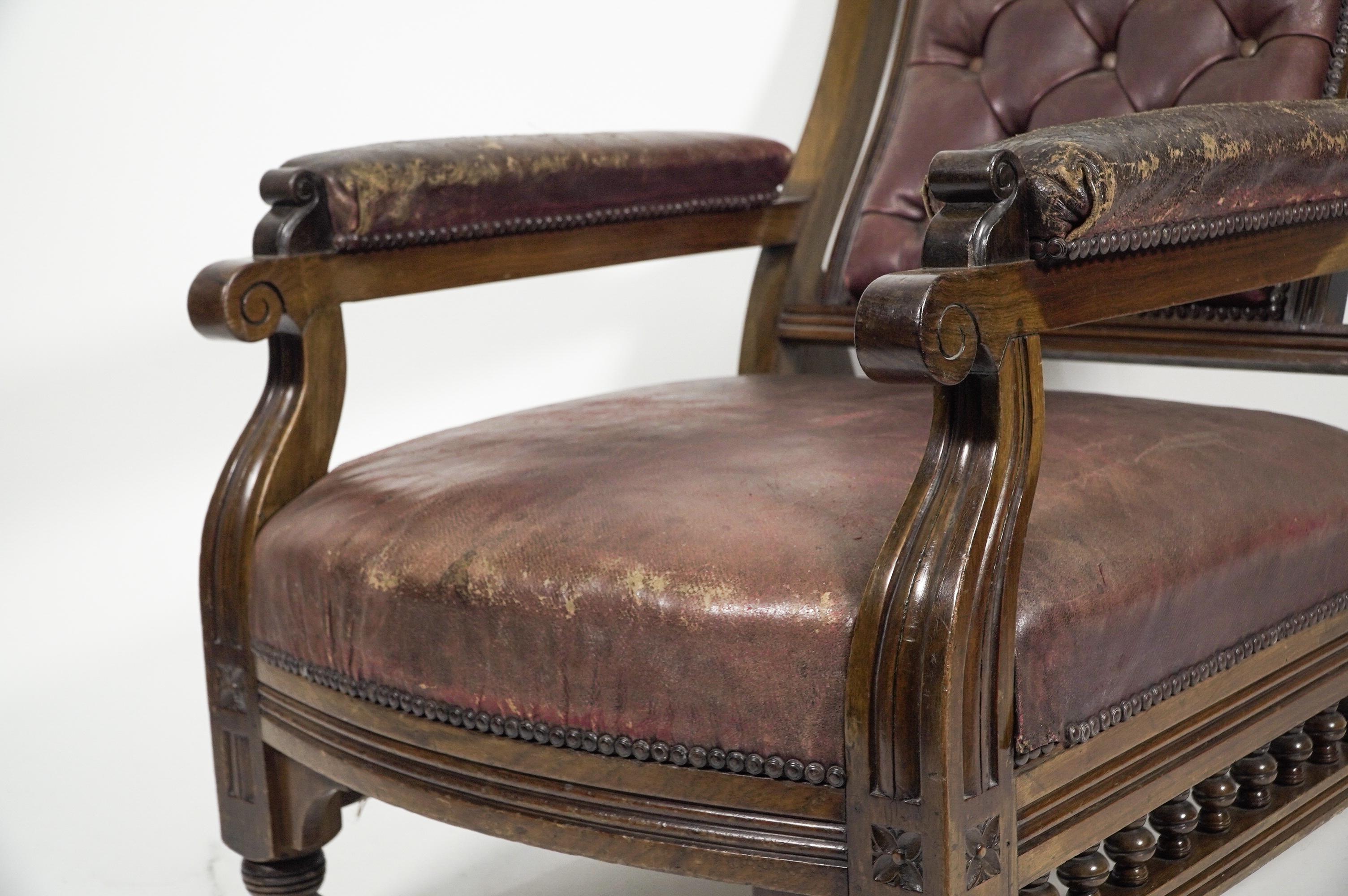 An Aesthetic Movement walnut armchair with a curvaceous back leather upholstery. For Sale 2
