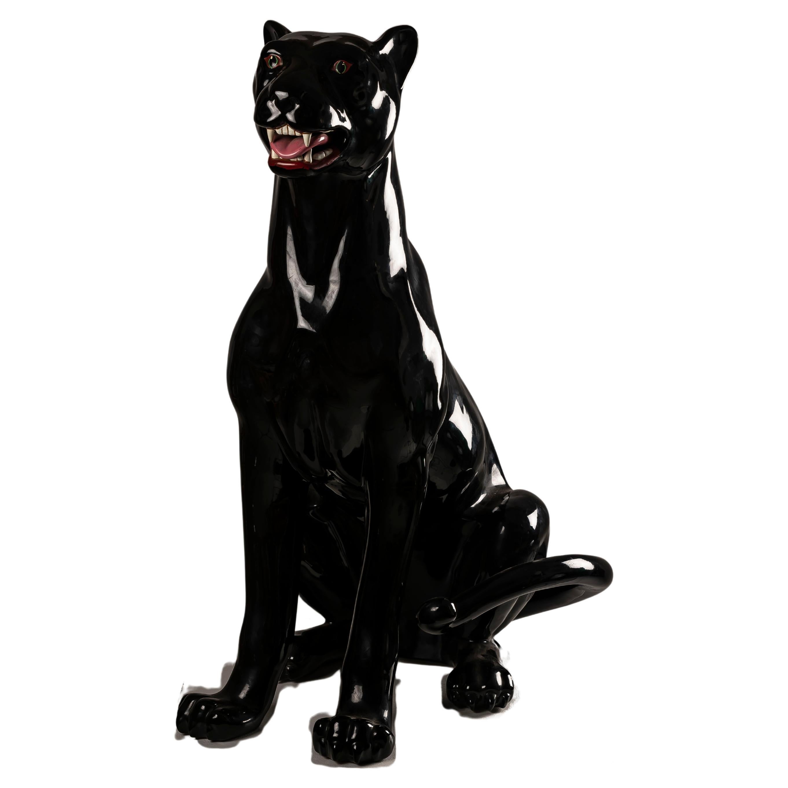 The XXL Black Panther Spanish ceramic BONDIA is more than just a decorative piece; it's a statement of elegance, strength, and cultural significance. Crafted with meticulous attention to detail, this majestic panther statue captures the essence of
