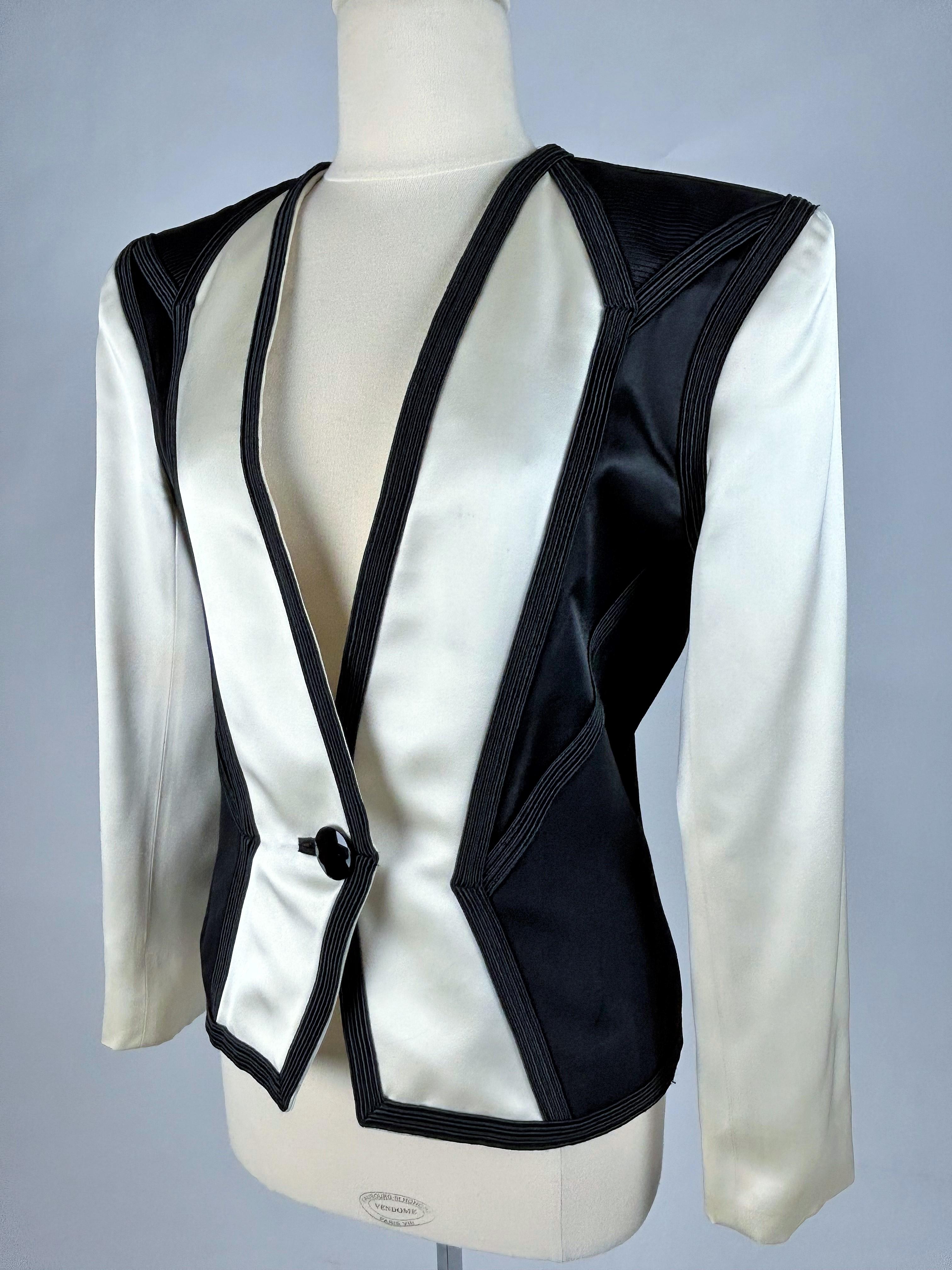 On hold for a french exhibition until November 2024, available after this date
Circa 1988-1990

France

Black and white tuxedo jacket by Yves Saint Laurent Rives Gauche, from the famous couturier's Autumn Winter 1988-1989 collection. The young Anna