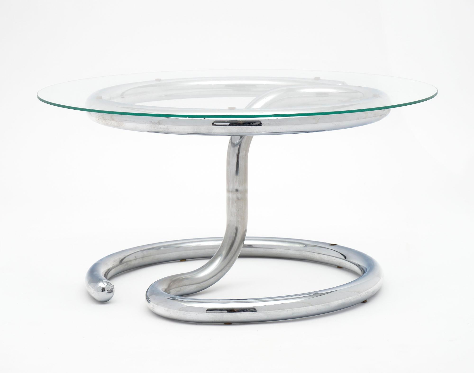 Chromed steel and glass coffee table by Paul Tuttle for Strässle. This mid-century modern piece is in excellent vintage condition. The chromed steel base has slight imperfections with age (scratches; little to no oxidation). The glass is in