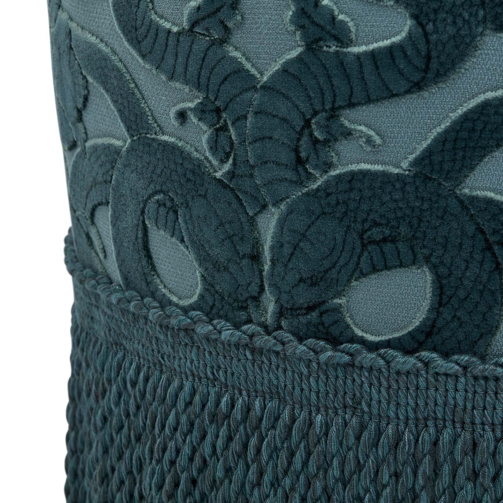 A trinity of House signatures intertwine on the ANACONDA Bottoman: our symbol of the snake, slithering across cut-velvet, the opulent shade of 'Petrol' blue and (of course) the design itself; a tongue-in-cheek take on the ottoman, crafted by the